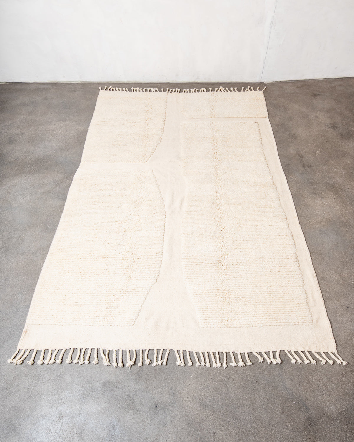 Modern, designer, handcrafted Berber rug from Morocco. Beniourain carpet with minimalist design, natural wool pile and a fluffy texture.
